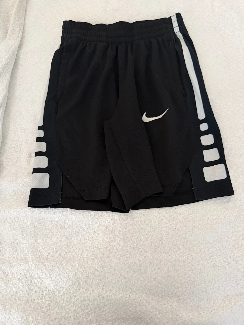 Nike Black Athletic Shorts with White Swoosh and Side Panels